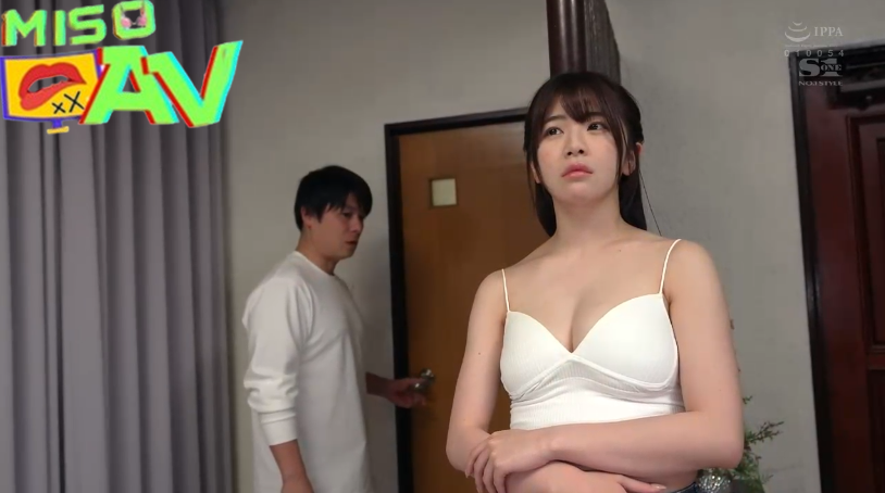 a woman in a white dress standing in front of a man in a doorway